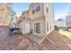 Backyard with a concrete patio and air conditioning unit at 907 Redwood Dr, Norcross, GA 30093