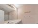Bathroom with a large mirror, sink with vanity and a combination shower and tub at 907 Redwood Dr, Norcross, GA 30093