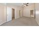 Large bedroom featuring a ceiling fan, closet and ensuite bathroom at 907 Redwood Dr, Norcross, GA 30093