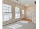 Sun-drenched entryway with lots of natural light, sleek hardwood floors, and access to the stairway at 907 Redwood Dr, Norcross, GA 30093
