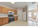 Bright, spacious kitchen featuring modern appliances and plenty of cabinet space, with adjoining dining area at 907 Redwood Dr, Norcross, GA 30093