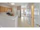 Open-concept kitchen with breakfast bar, wooden cabinets and modern appliances with an adjacent living area at 907 Redwood Dr, Norcross, GA 30093