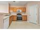 Bright kitchen features wooden cabinetry, modern appliances, and a clean, functional layout at 907 Redwood Dr, Norcross, GA 30093