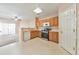 Well-lit kitchen with wooden cabinets and modern appliances, showcasing a functional cooking space at 907 Redwood Dr, Norcross, GA 30093