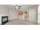 Inviting living room featuring a fireplace and seamless access to an open-concept kitchen at 907 Redwood Dr, Norcross, GA 30093