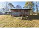 Charming home features a screened porch with wood stairs and a blue painted exterior at 217 Woodglen Dr, Woodstock, GA 30188