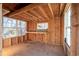 Unfinished interior of a shed featuring wood framing, windows and a work bench at 217 Woodglen Dr, Woodstock, GA 30188