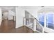 Bright hallway features dark wood floors, railing and ample natural light from windows at 634 Delmar Se Ave, Atlanta, GA 30312