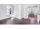 Bright living room featuring hardwood floors, white walls, and an open doorway to the dining area at 634 Delmar Se Ave, Atlanta, GA 30312