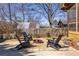 Backyard with a fire pit and Adirondack chairs near a fenced-in area at 1101 United Se Ave, Atlanta, GA 30316