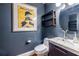 Charming powder room with a modern sink, artwork, floating shelf, and stylish fixtures at 1101 United Se Ave, Atlanta, GA 30316