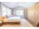 Bright bedroom features a vaulted ceiling, large windows, modern furnishings, and minimalist decor at 1101 United Se Ave, Atlanta, GA 30316