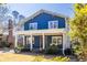 Charming two-story blue home with a covered front porch and manicured landscaping at 1101 United Se Ave, Atlanta, GA 30316