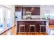 This kitchen features an island with bar stool seating, stainless steel appliances, and glass doors to the patio at 1101 United Se Ave, Atlanta, GA 30316