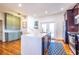 Bright kitchen with stainless steel appliances, hardwood floors, and a center island with countertop seating at 1101 United Se Ave, Atlanta, GA 30316
