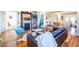 Open-concept living room with fireplace that flows into dining and kitchen areas at 1101 United Se Ave, Atlanta, GA 30316