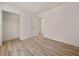 Bedroom with closet, neutral paint, updated baseboards, and laminate wood flooring at 130 Valley Rd, Stockbridge, GA 30281