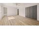Bedroom featuring neutral walls, ceiling fan, and hardwood floors and bi-fold closet at 130 Valley Rd, Stockbridge, GA 30281
