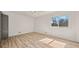 Bright bedroom features neutral walls, modern ceiling fan, and light wood flooring at 130 Valley Rd, Stockbridge, GA 30281