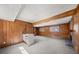 Large living area boasts wood paneled walls, stone fireplace, and bonus island for entertaining at 130 Valley Rd, Stockbridge, GA 30281