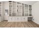 Large built-in shelves and cabinets offering storage in a room with light-colored floors at 130 Valley Rd, Stockbridge, GA 30281