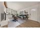 Living room boasts a feature wall with built-in shelving and cabinetry, plus a large picture window at 130 Valley Rd, Stockbridge, GA 30281