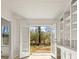 Bright living area with French doors to backyard and built-in shelves and cabinets at 130 Valley Rd, Stockbridge, GA 30281
