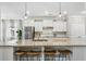 Stylish kitchen island with granite countertops, bar stool seating, and pendant lighting at 315 Edinburgh Ln, Woodstock, GA 30188