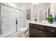 Modern bathroom with glass door shower, dark cabinets, and white quartz countertops at 169 Aspen Hall Dr, Canton, GA 30115