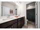 Bathroom with double sink vanity, quartz countertop, and tiled floor at 169 Aspen Hall Dr, Canton, GA 30115