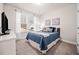 Cozy bedroom features large window with natural light and comfortable queen size bed at 169 Aspen Hall Dr, Canton, GA 30115