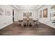 Elegant dining room with decorative lighting, neutral walls, and luxury vinyl flooring at 169 Aspen Hall Dr, Canton, GA 30115