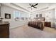 Serene bedroom featuring tray ceilings, large windows, and plush carpet at 169 Aspen Hall Dr, Canton, GA 30115