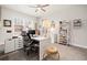 Bright home office with white desk, comfortable chair, natural lighting, and stylish decor at 169 Aspen Hall Dr, Canton, GA 30115