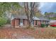 Beautiful brick home with mature trees and landscaping at 8309 Dunellen Ln, Jonesboro, GA 30238