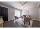 Cozy living room with a ceiling fan, neutral walls, modern furnishings, a large window and dark wood floors at 8309 Dunellen Ln, Jonesboro, GA 30238