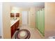 This primary bathroom features a large vanity with dual sinks and a tile shower at 980 Yancey Ct, Loganville, GA 30052