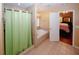 This bathroom features a tile shower and luxurious soaking tub with a view into the main bedroom at 980 Yancey Ct, Loganville, GA 30052