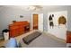 Neutral bedroom featuring a spacious closet and dresser, with a comfortable bed at 980 Yancey Ct, Loganville, GA 30052