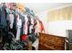 Walk-in closet well stocked with clothing and offering ample storage space at 980 Yancey Ct, Loganville, GA 30052