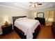 This main bedroom features a tray ceiling, hardwood floors, and an ensuite bathroom at 980 Yancey Ct, Loganville, GA 30052