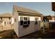 Charming backyard shed offering additional storage and aesthetic appeal with black shutters at 980 Yancey Ct, Loganville, GA 30052