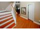 Interior view of a staircase with hardwood floors and painted risers, leading to the upper level at 980 Yancey Ct, Loganville, GA 30052