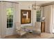 Inviting living room featuring classic chairs, an elegant marble table, and natural light from the windows at 104 Grand Cres, Alpharetta, GA 30009