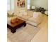 Comfortable living room with a beige couch, hardwood floors, and a striped rug at 104 Grand Cres, Alpharetta, GA 30009