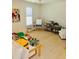 Bright and spacious playroom with hardwood floors and various activity centers at 104 Grand Cres, Alpharetta, GA 30009