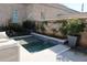 Swimming pool with a water feature amidst greenery, perfect for outdoor relaxation at 104 Grand Cres, Alpharetta, GA 30009