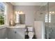 This bathroom offers a vanity with a sink, toilet, and tiled glass-enclosed shower at 18 Blackland Nw Rd, Atlanta, GA 30342