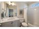 Bright bathroom featuring a marble vanity, subway tile, and a shower-tub combo at 18 Blackland Nw Rd, Atlanta, GA 30342