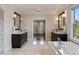 Bright bathroom featuring double vanities, soaking tub, and white marble floors at 18 Blackland Nw Rd, Atlanta, GA 30342